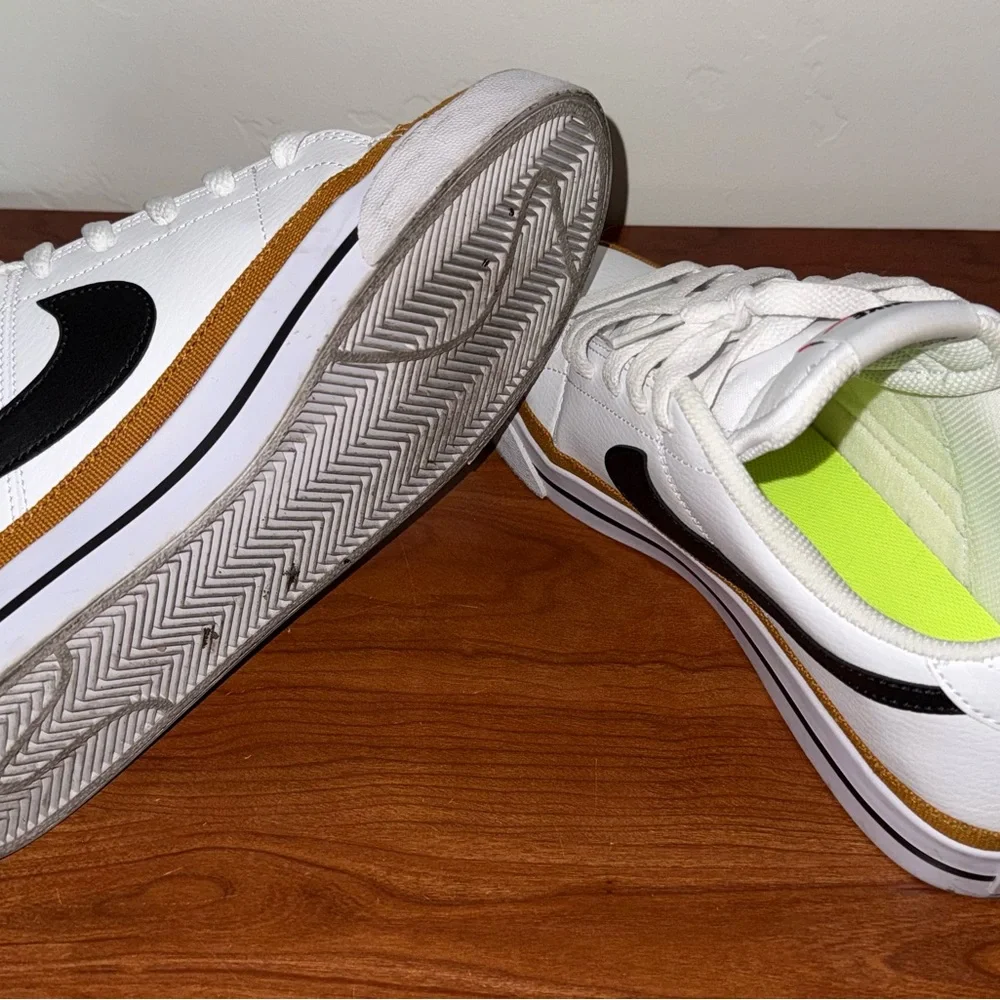 Nike White Sneakers with Black Swoosh and Gold Accent - Picture 7 of 7